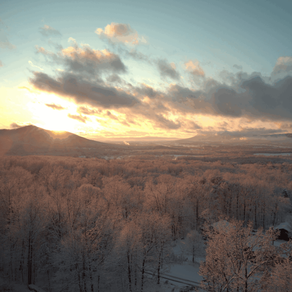 Aerial view of a snow-covered Shenandoah Valley at sunset, looking toward Elkton, McGaheysville, and Massanutten, Virginia.