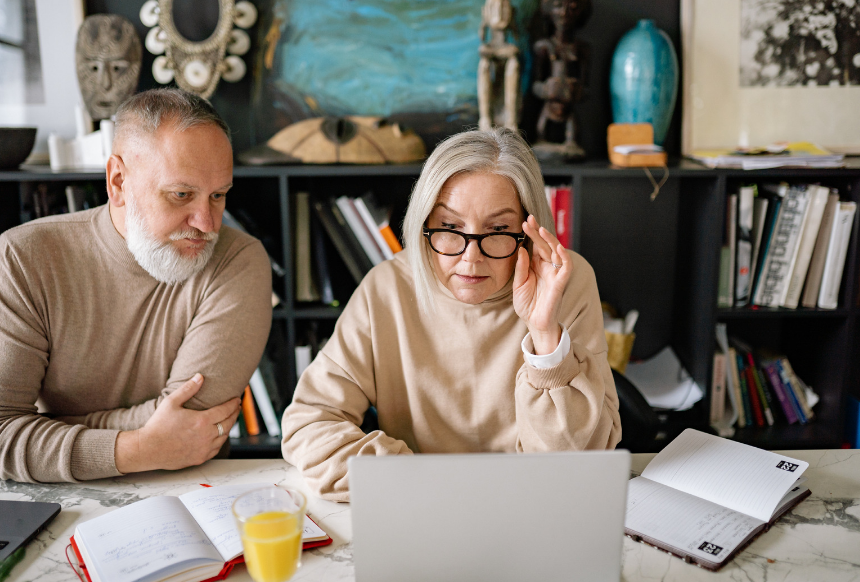 Couple reviewing retirement planning information together at home