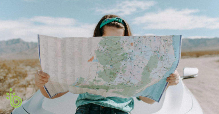Woman using a map, representing a roadmap for retirement planning milestones