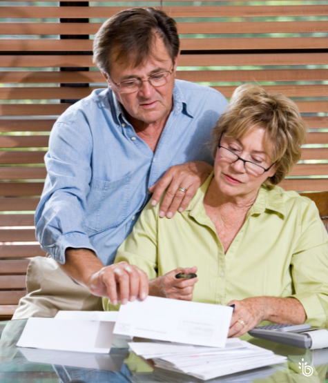Couple reviewing financial documents together at home